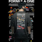 Person wearing a black Formula One-themed t-shirt with car illustrations on the back, standing against a black background with Formula One car images.
